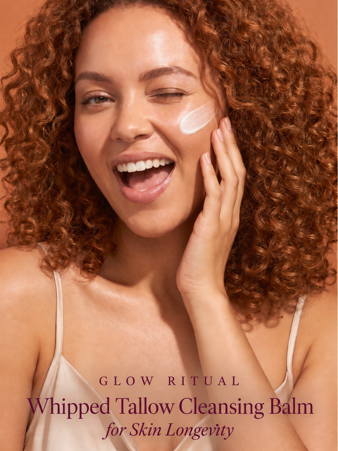 Woman cleansing her face with Glow Ritual Skin Longevity Tallow Cleansing Balm